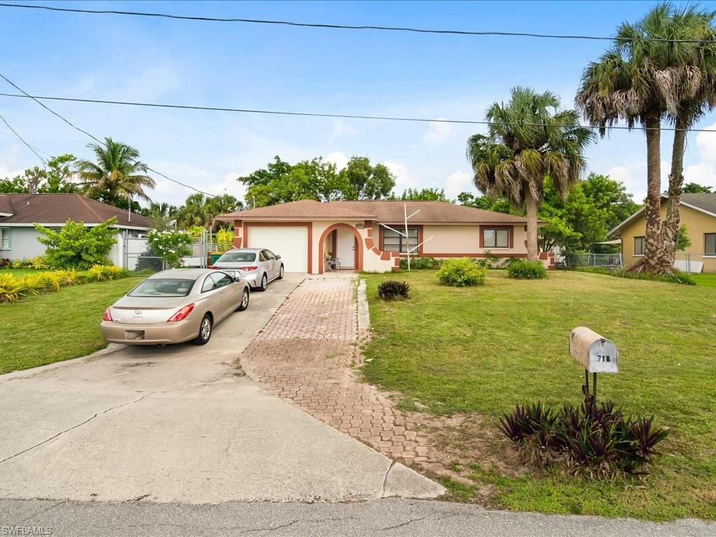 4865 22nd Avenue Southwest Naples, FL 34116 - Photo 20 of 20 a front view of a house with garden