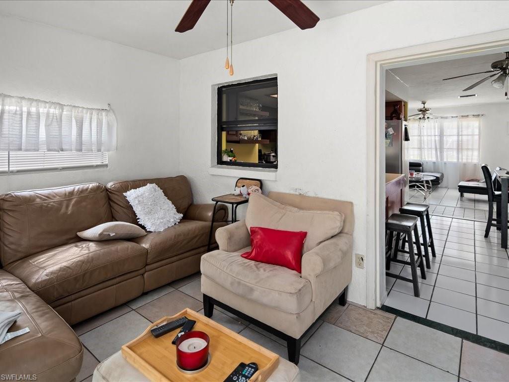 4865 22nd Avenue Southwest Naples, FL 34116 - Photo 8 of 20 a living room with furniture and wooden floor