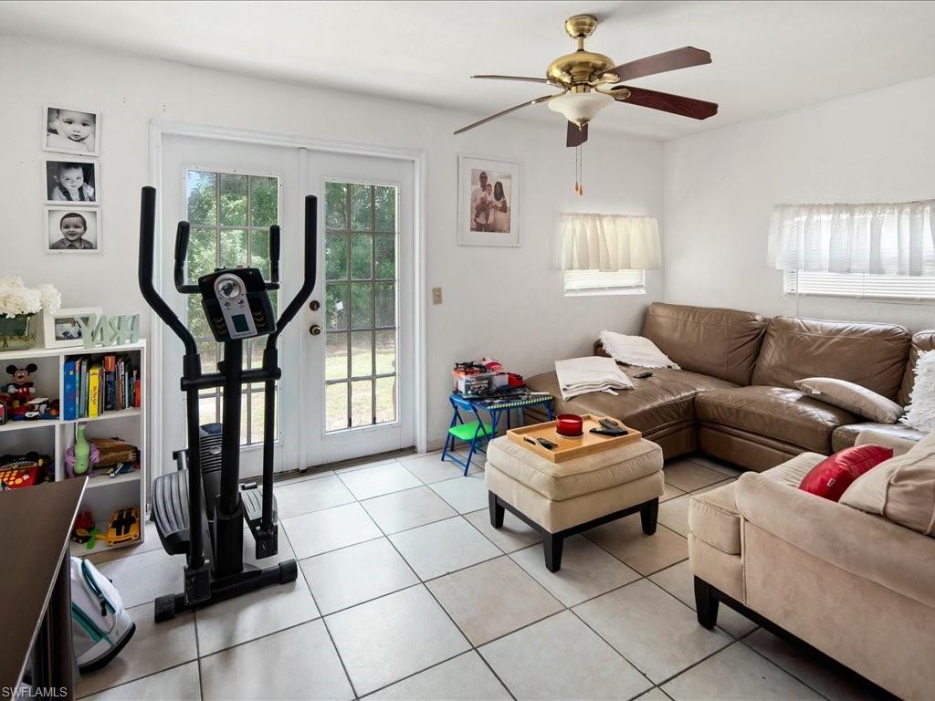 4865 22nd Avenue Southwest Naples, FL 34116 - Photo 9 of 20 a living room with furniture and a window