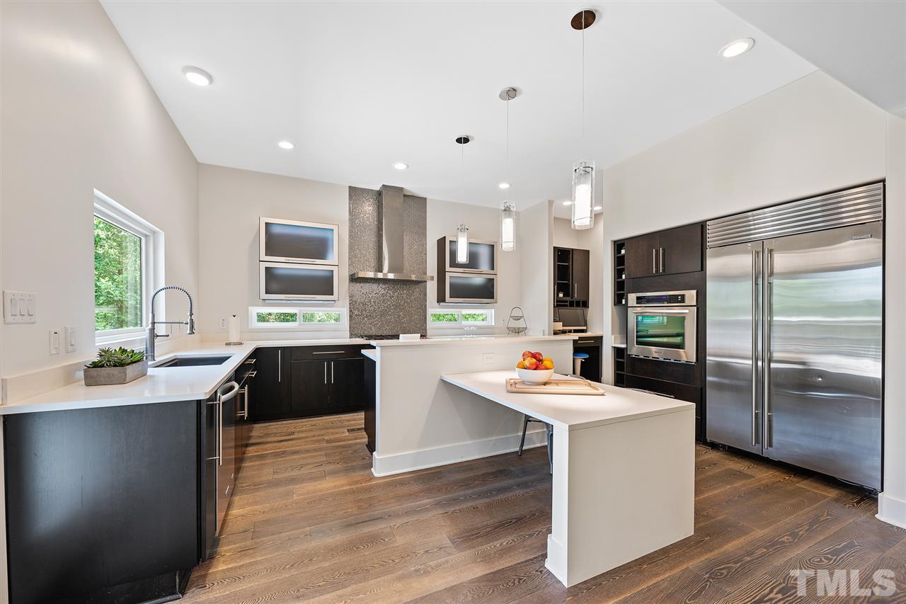 2120 Old Sorrell Road Apex, NC 27539 - Photo 11 of 30 Kitchen cabinets: pull out cutting board, pull out mixer/small appliance table, 3 special cutlery drawers.