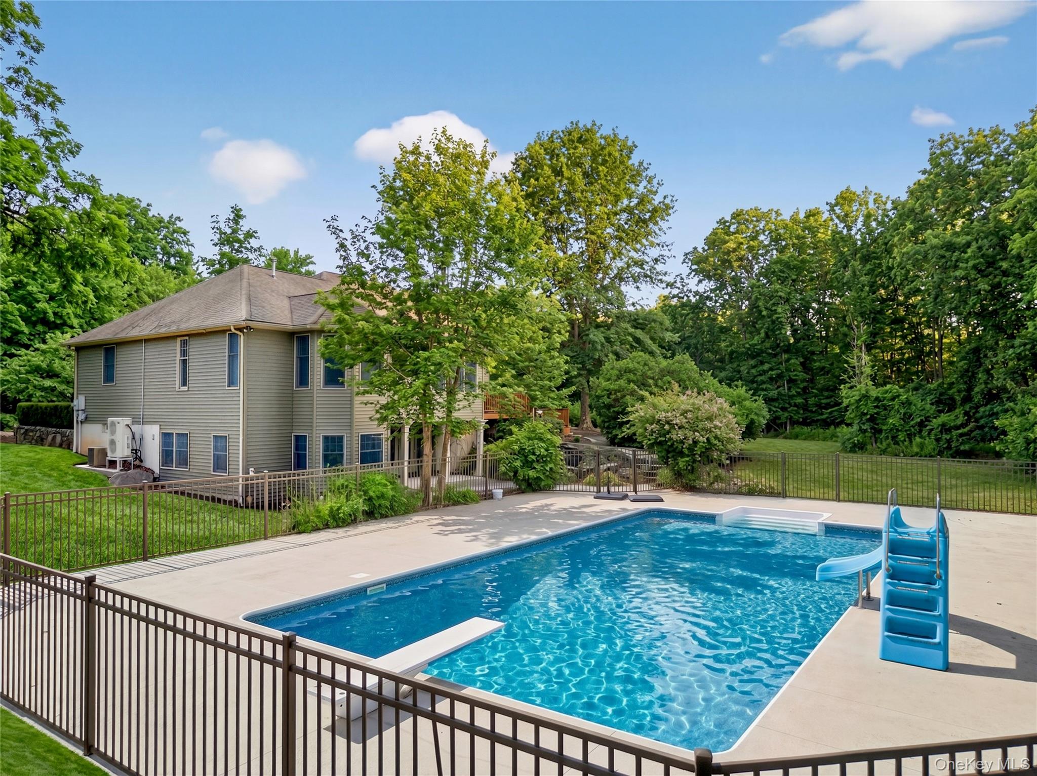464 Union School Road Middletown, NY 10941 - Photo 41 of 49 a view of a patio with a table and chairs under an umbrella