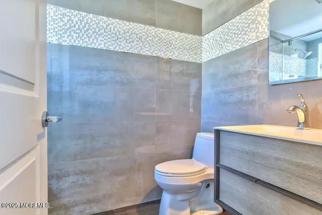 a bathroom with a shower and a window