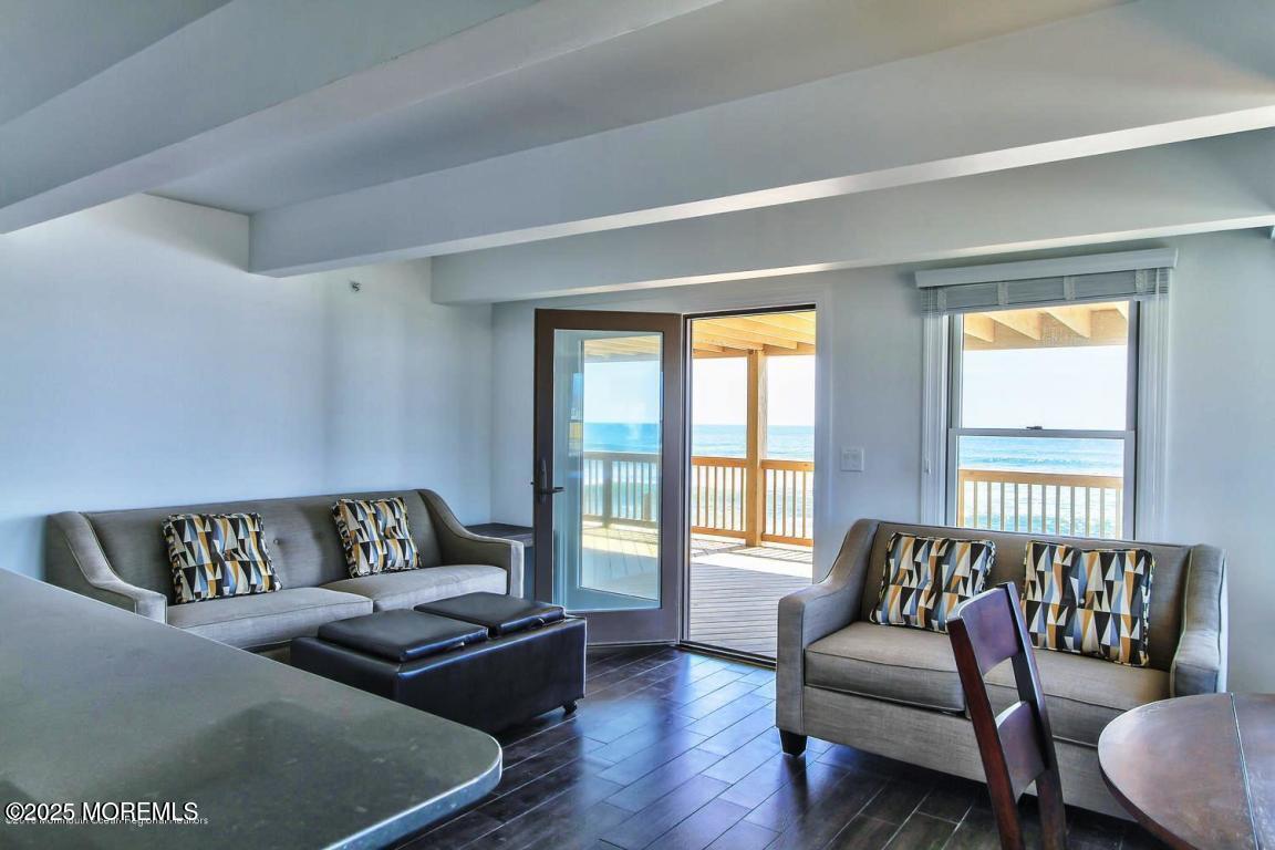1926 Oceanfront, Unit 14 Seaside Heights, NJ 08751 - Photo 4 of 21 a living room with furniture and a large window