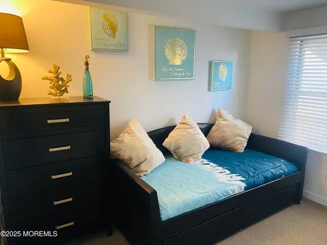 a bed room with a bed and a window