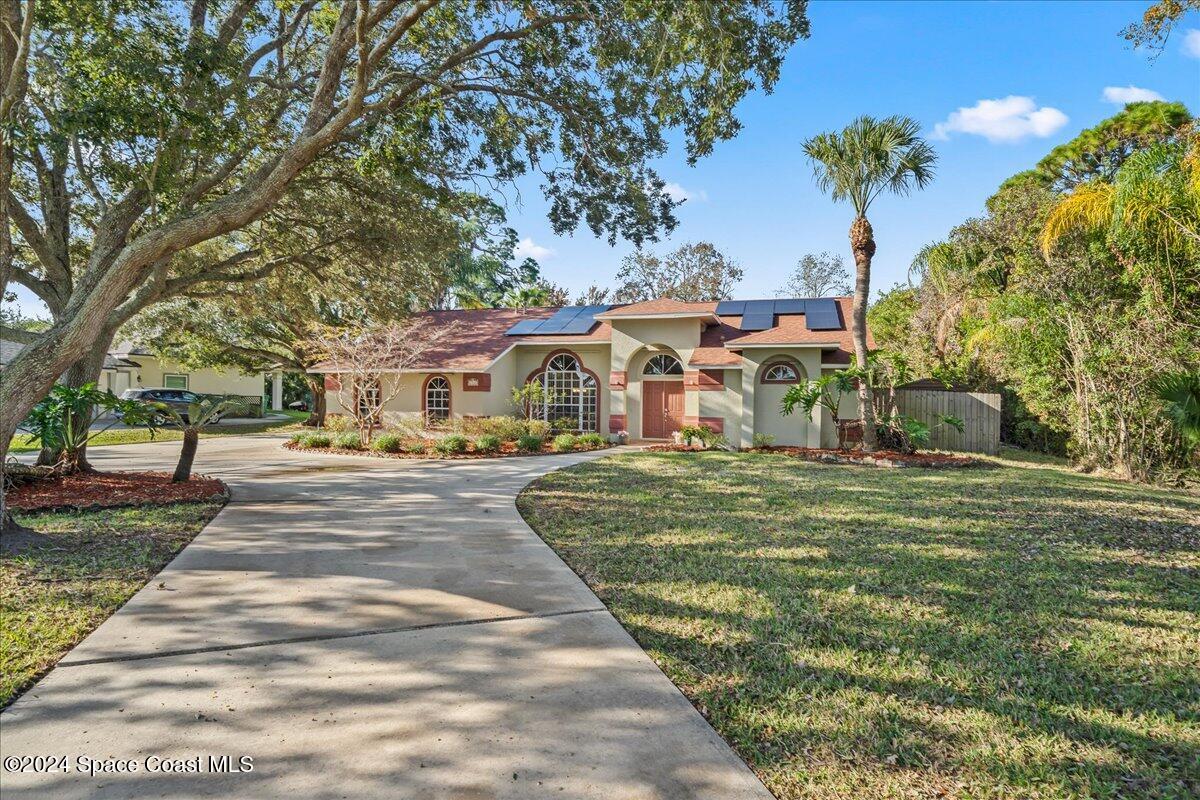 4360 Canard Road Melbourne, FL 32934 - Photo 1 of 54 a front view of a house with a yard