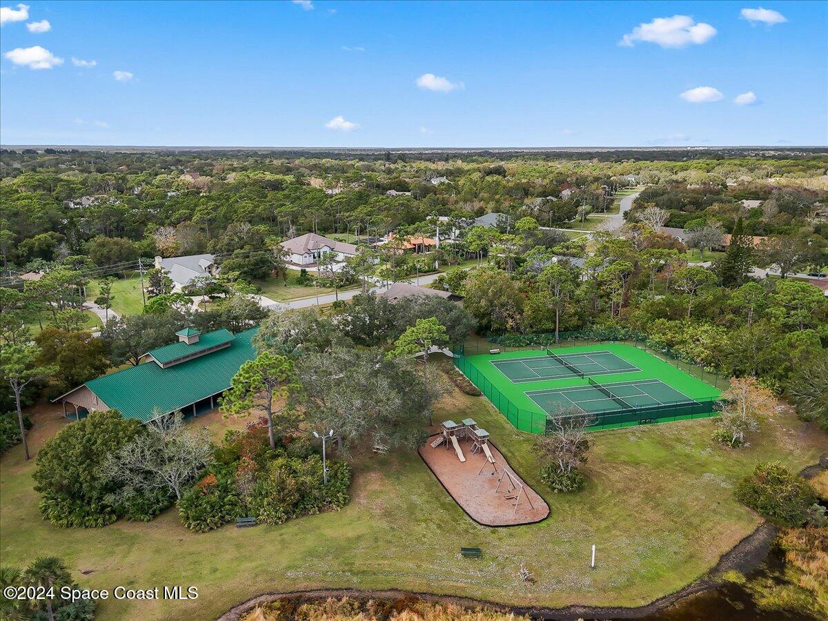 4360 Canard Road Melbourne, FL 32934 - Photo 24 of 54 an aerial view of a residential houses with outdoor space and swimming pool