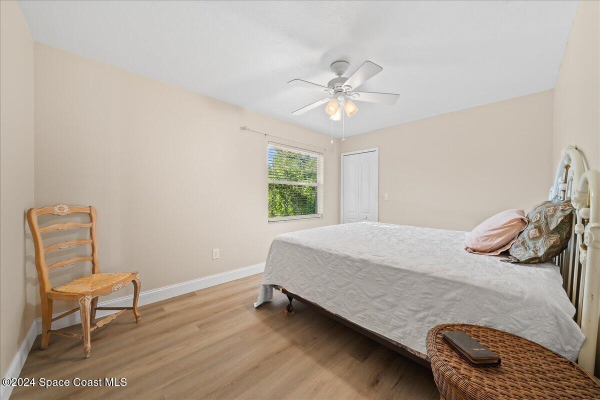 4360 Canard Road Melbourne, FL 32934 - Photo 26 of 54 a bedroom with a bed and chair