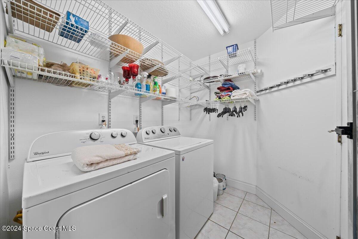 4360 Canard Road Melbourne, FL 32934 - Photo 31 of 54 a utility room with dryer and washer