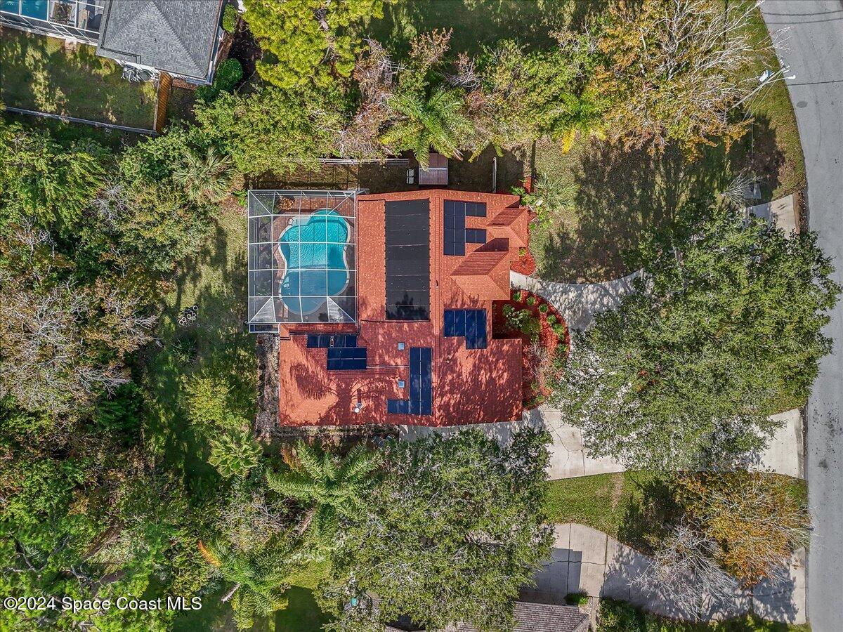 4360 Canard Road Melbourne, FL 32934 - Photo 33 of 54 an aerial view of a house with a yard and large trees