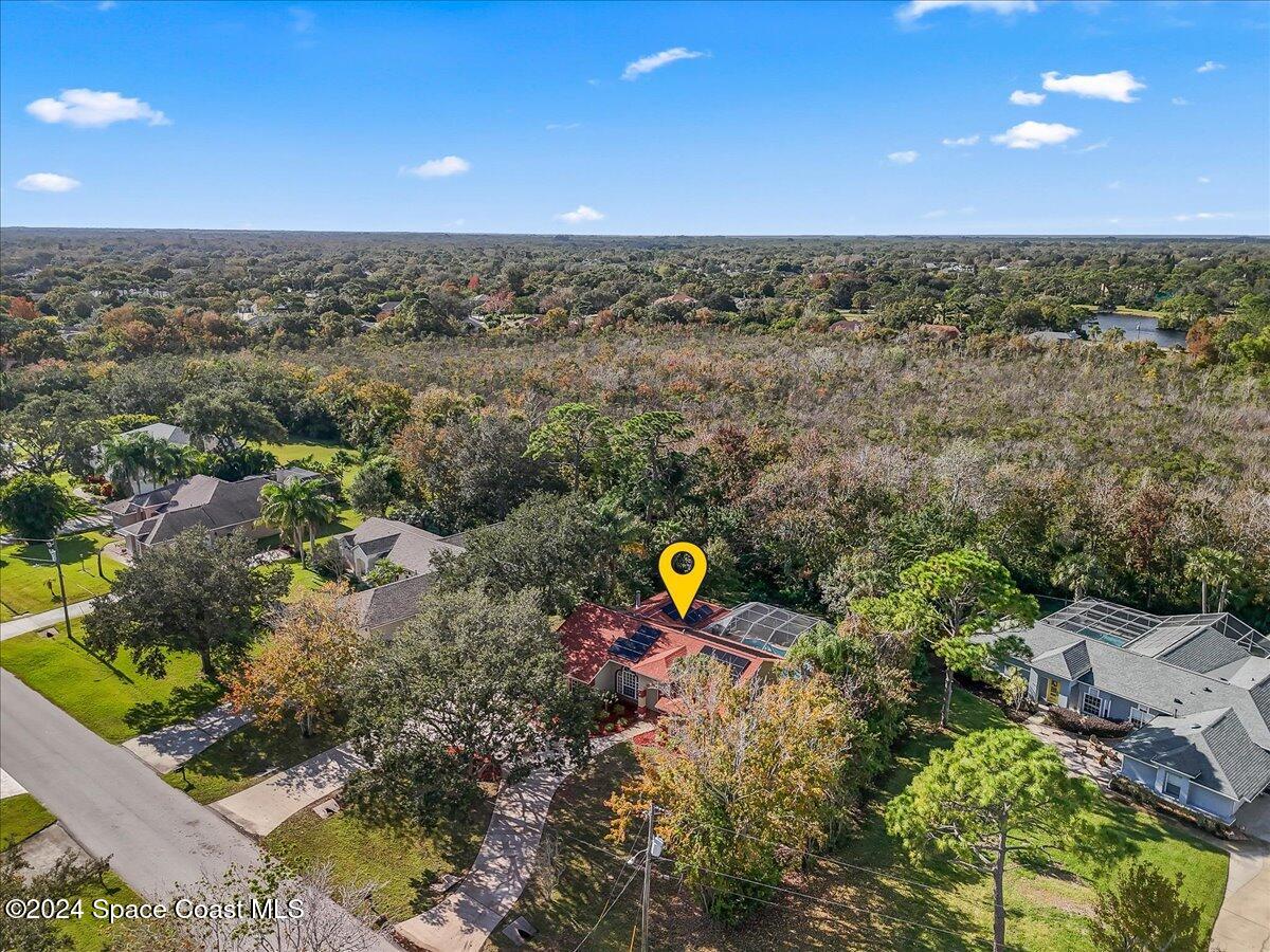 4360 Canard Road Melbourne, FL 32934 - Photo 34 of 54 an aerial view of a houses with a yard