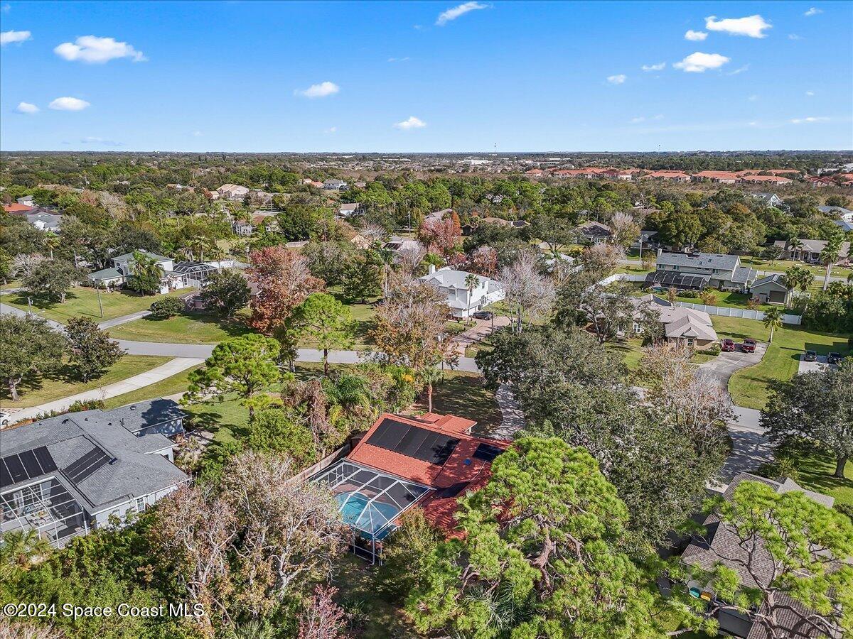 4360 Canard Road Melbourne, FL 32934 - Photo 38 of 54 an aerial view of a house with a yard