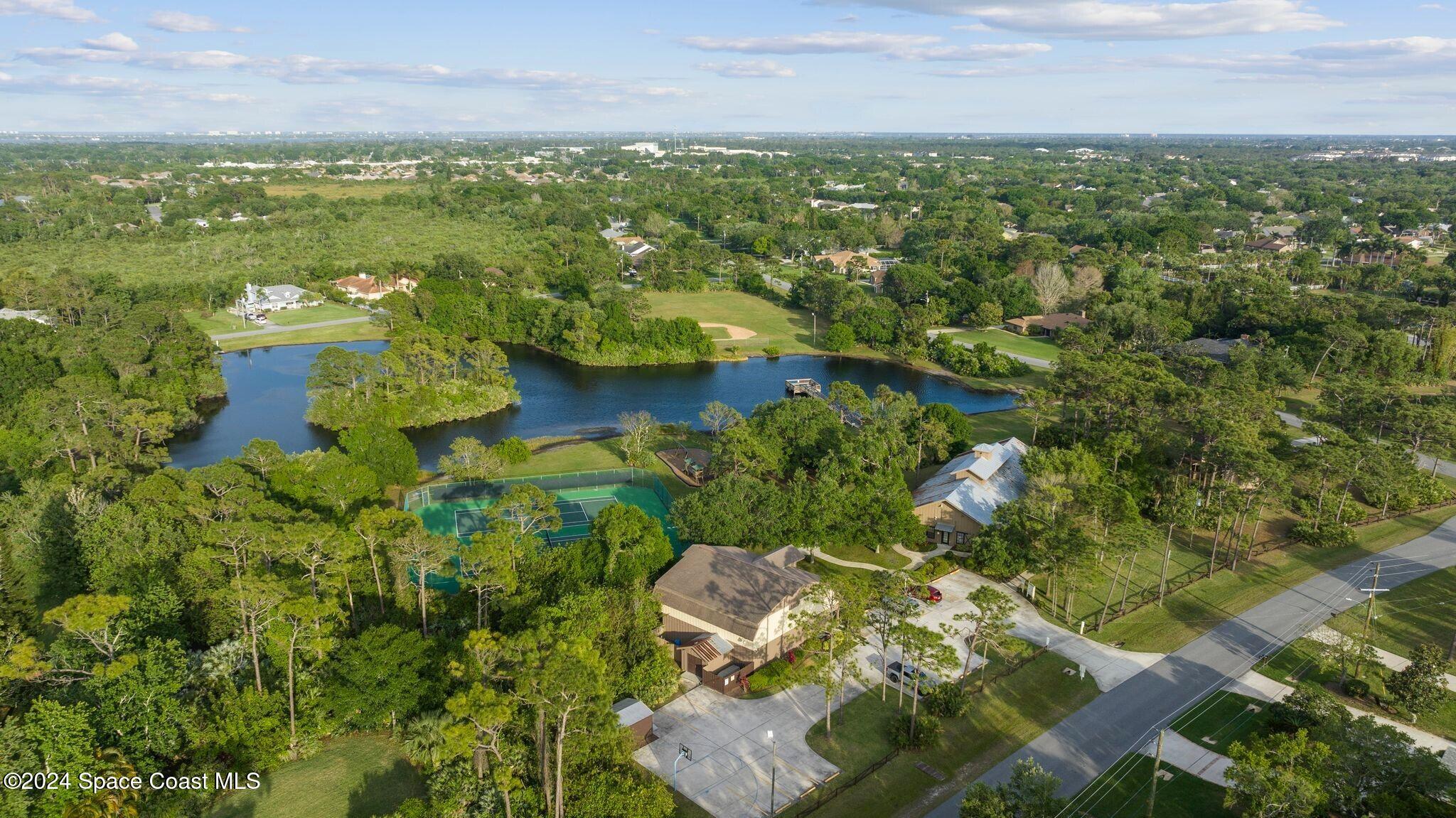 4360 Canard Road Melbourne, FL 32934 - Photo 48 of 54 an aerial view of residential houses with outdoor space and trees