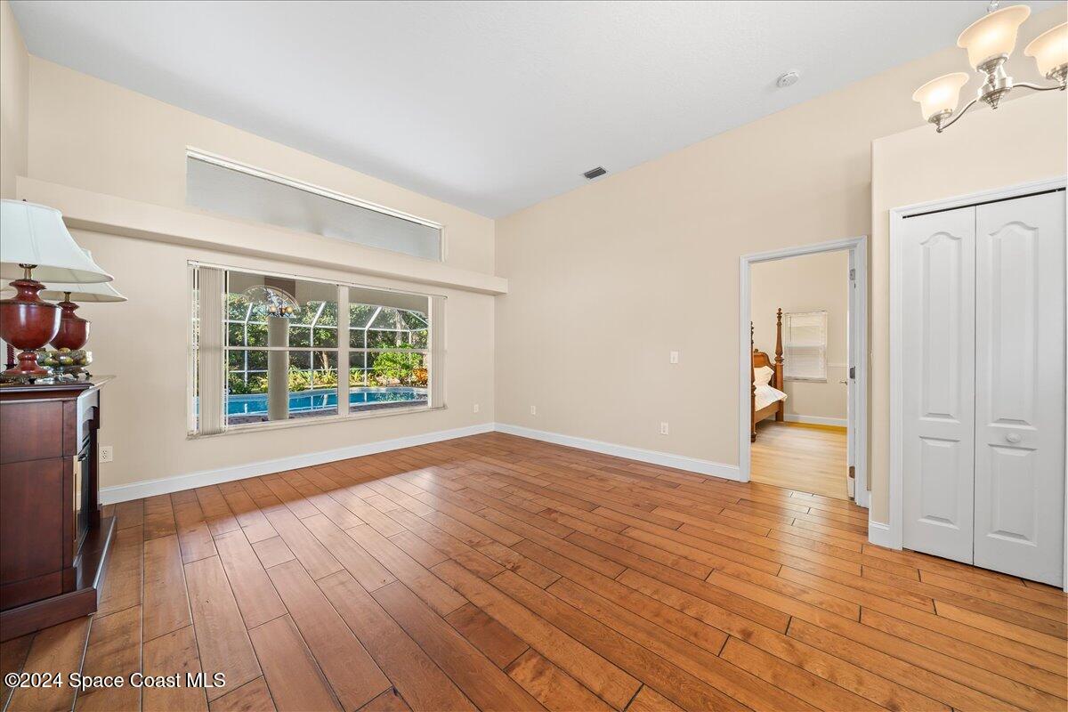 4360 Canard Road Melbourne, FL 32934 - Photo 5 of 54 a view of empty room with wooden floor and fan