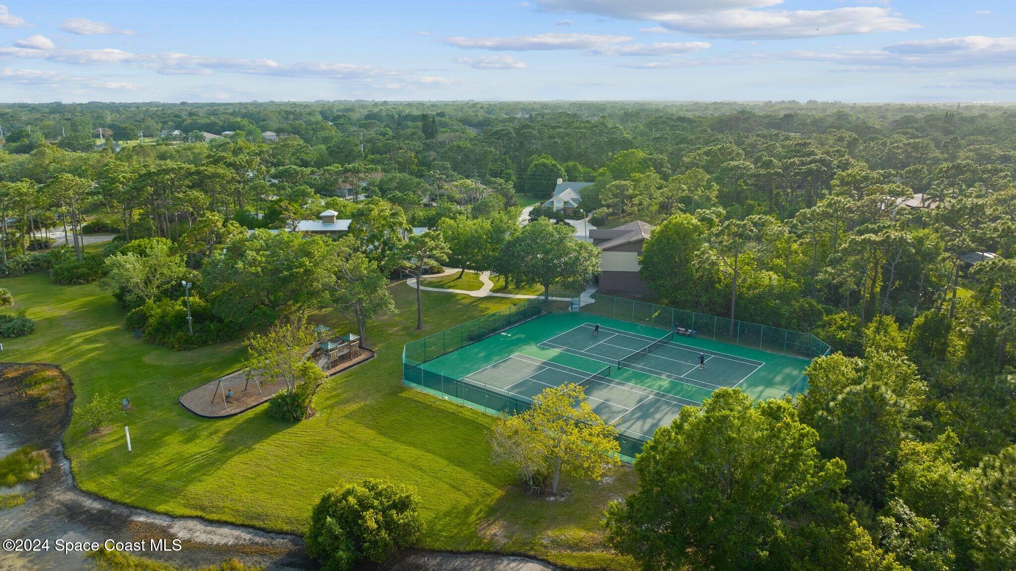 4360 Canard Road Melbourne, FL 32934 - Photo 51 of 54 an aerial view of a residential houses with outdoor space and trees all around
