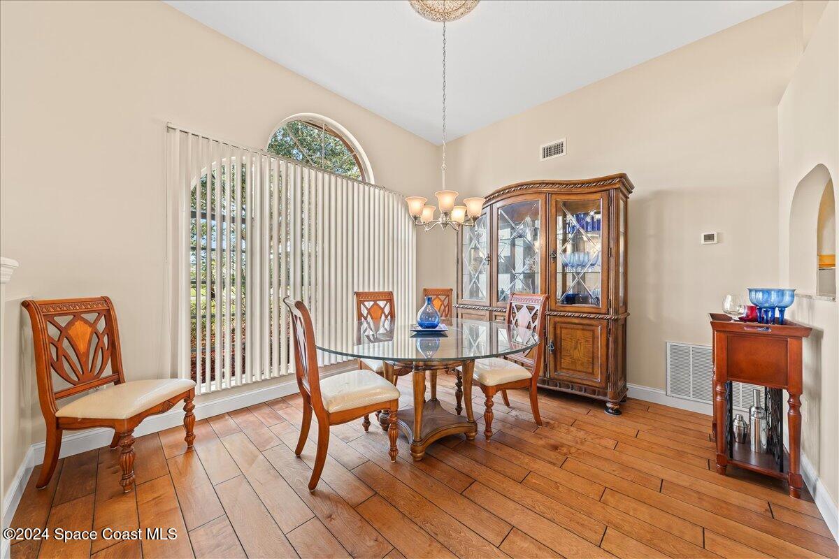4360 Canard Road Melbourne, FL 32934 - Photo 7 of 54 a view of a dining room with furniture and wooden floor