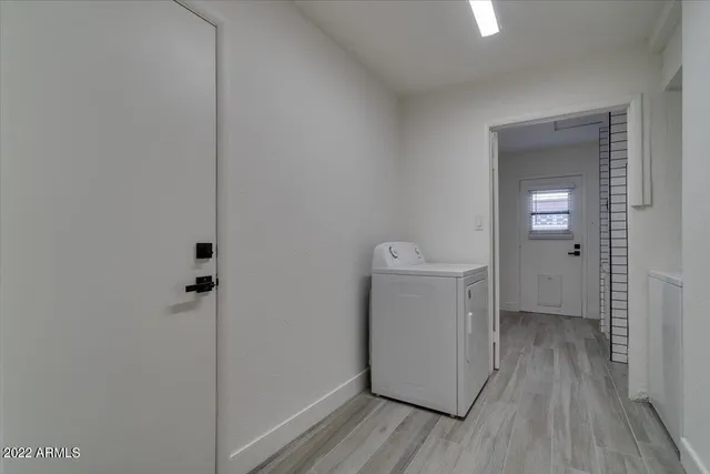 a view of hallway with wooden floor