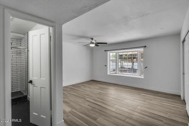 a view of an empty room with a window