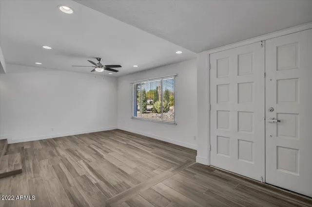 wooden floor in an empty room with a window