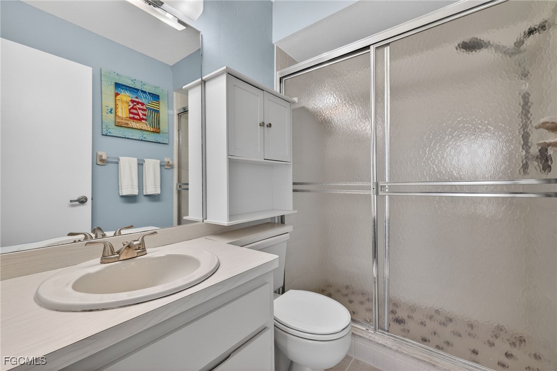 1100 Pondella Road, Unit 811 Cape Coral, FL 33909 - Photo 15 of 24 a bathroom with a sink toilet and shower