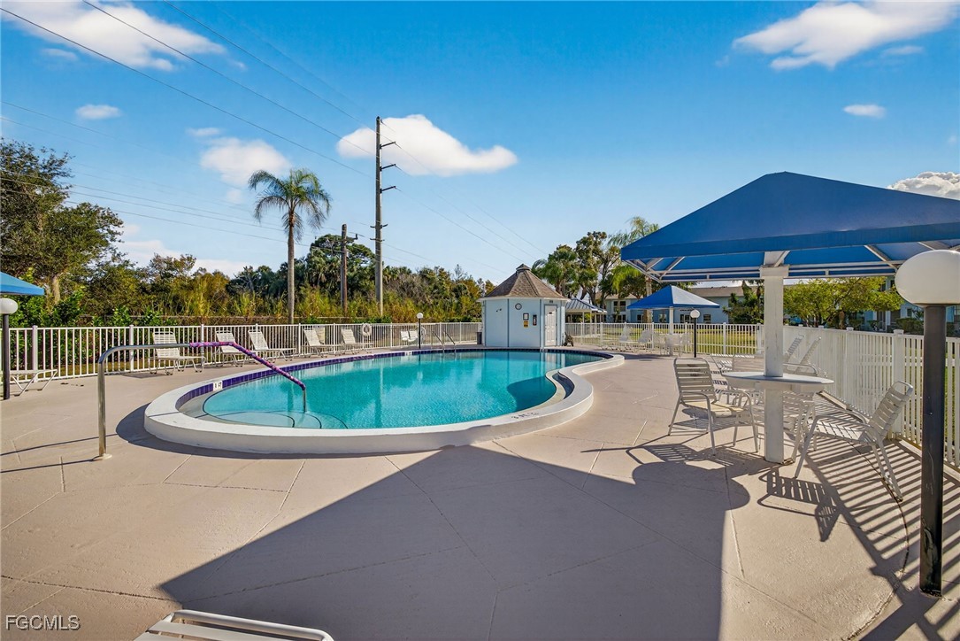 1100 Pondella Road, Unit 811 Cape Coral, FL 33909 - Photo 22 of 24 a view of a swimming pool with a patio