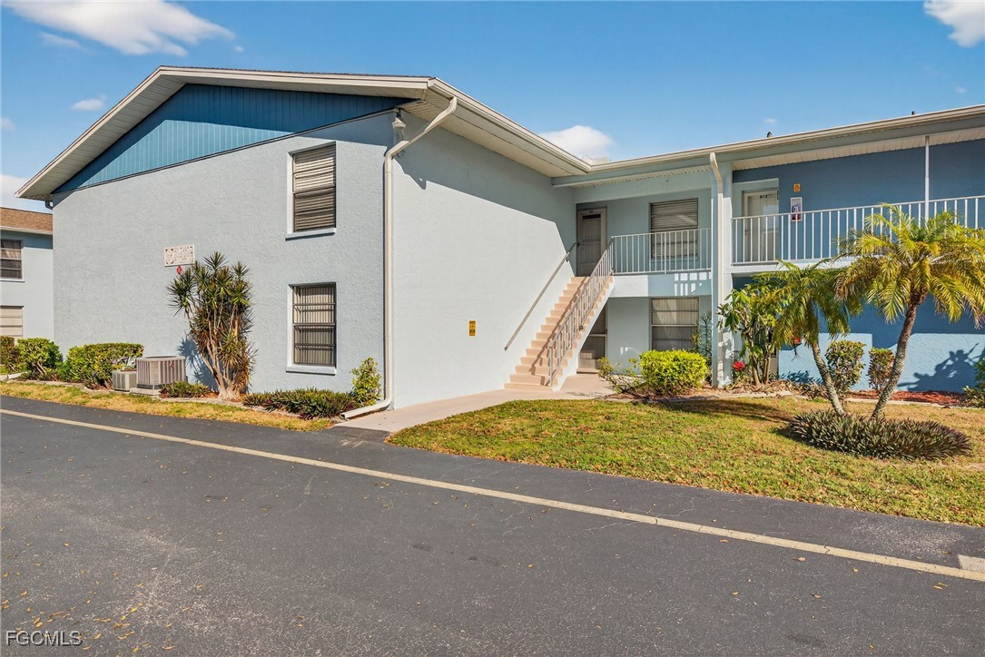 1100 Pondella Road, Unit 811 Cape Coral, FL 33909 - Photo 24 of 24 a view of a house with a yard and street view
