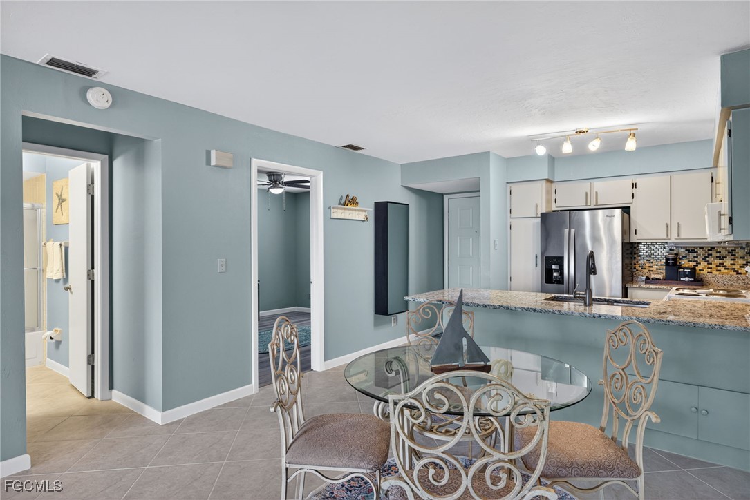 1100 Pondella Road, Unit 811 Cape Coral, FL 33909 - Photo 7 of 24 a living room with furniture and a large window