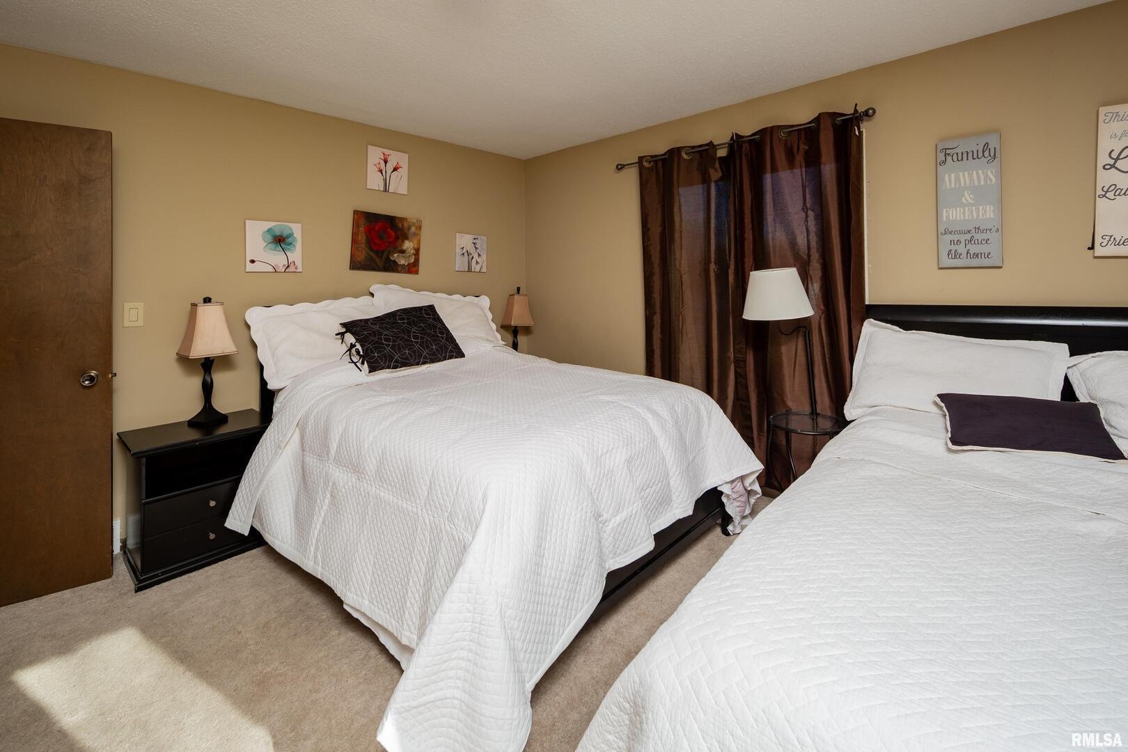 3623 34th Street Moline, IL 61265 - Photo 12 of 17 a bedroom with a bed and a closet