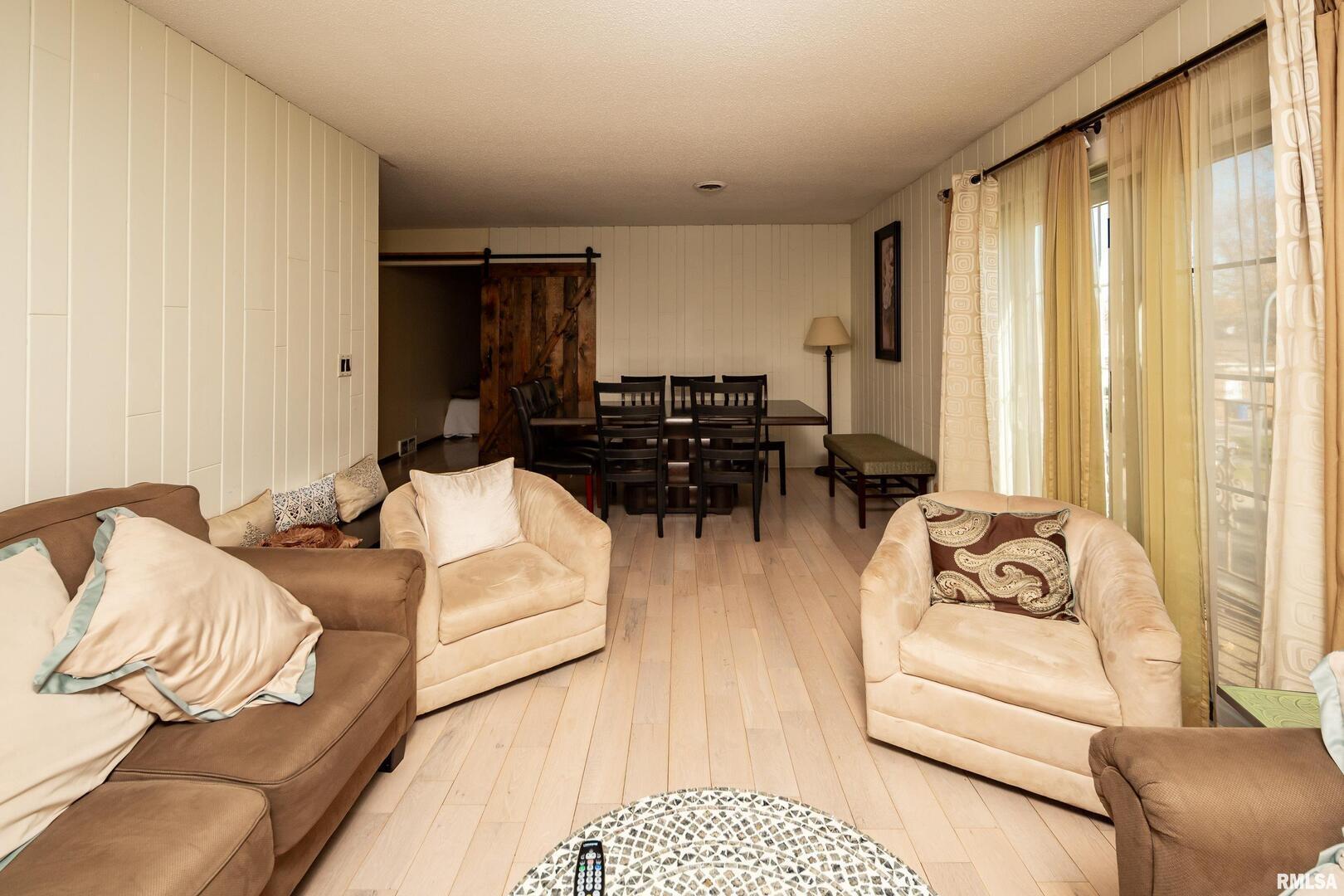 3623 34th Street Moline, IL 61265 - Photo 5 of 17 a living room with furniture and a large window
