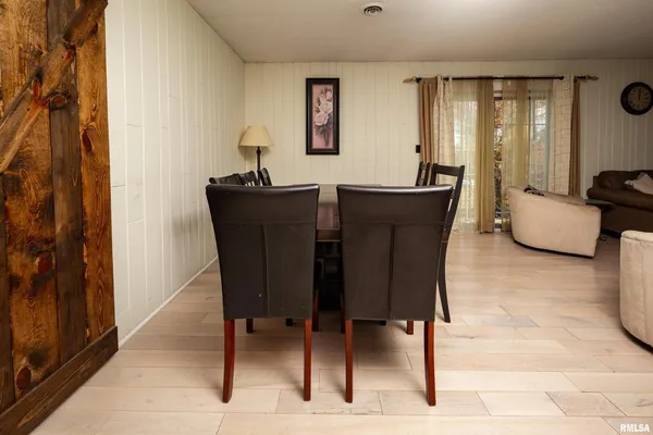 a dining room with furniture and window