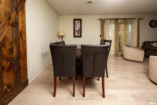 a dining room with furniture and window