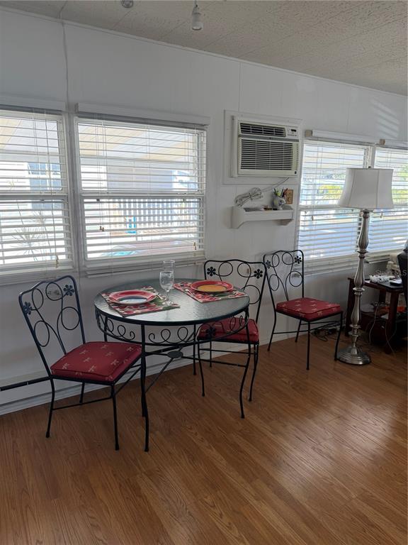 1040 Main Street, Unit 91 Dunedin, FL 34698 - Photo 11 of 25 a view of a dining room with furniture window and outside view