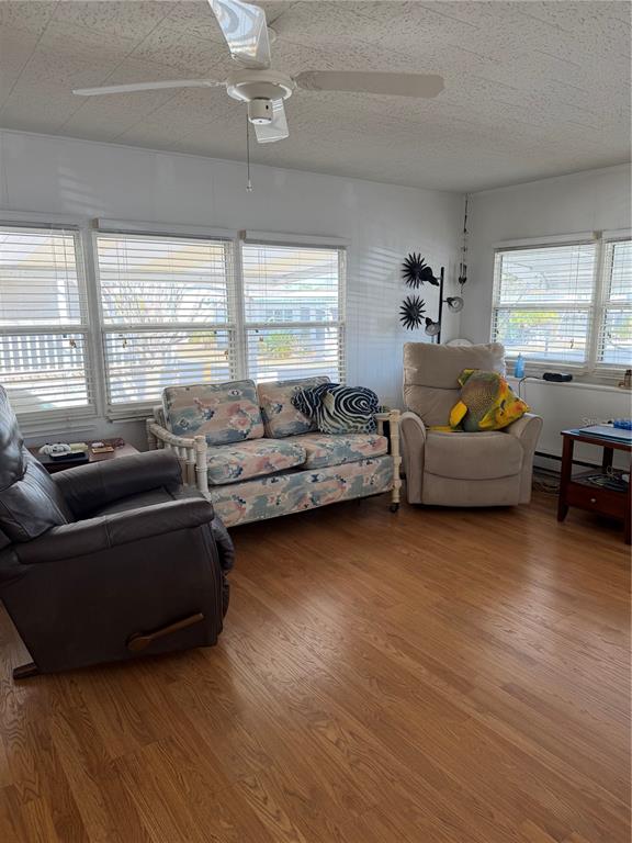 1040 Main Street, Unit 91 Dunedin, FL 34698 - Photo 14 of 25 a living room with furniture window and a wooden floor