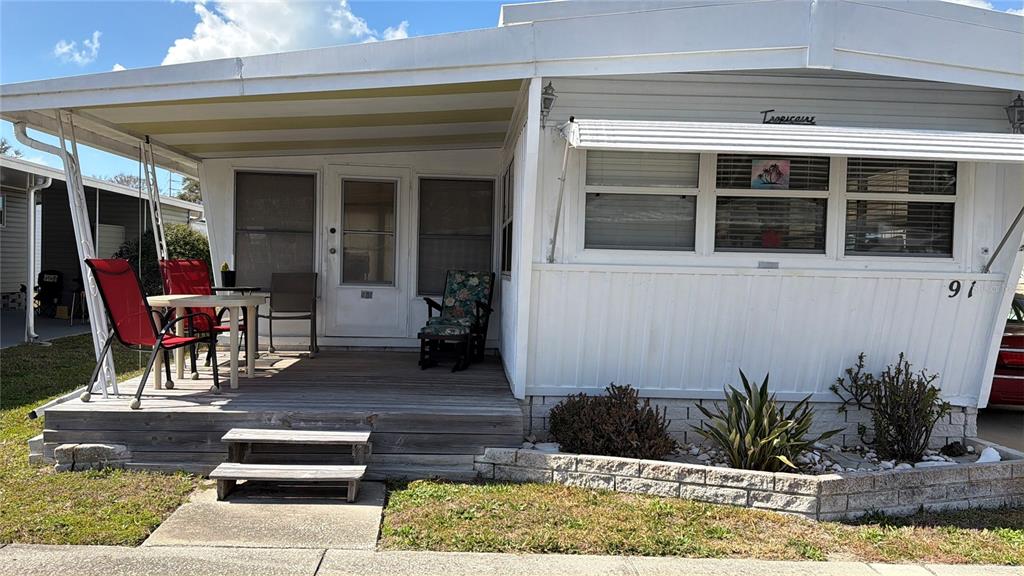 1040 Main Street, Unit 91 Dunedin, FL 34698 - Photo 25 of 25 a view of a entryway door front of house