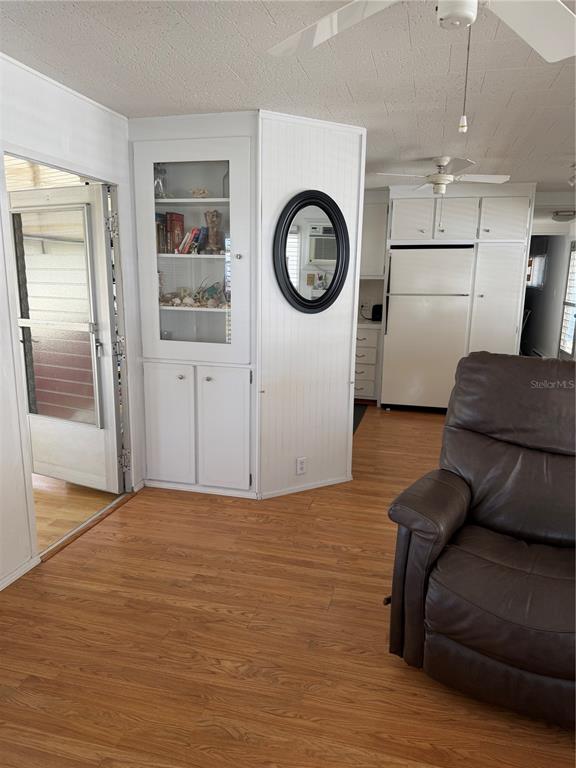 1040 Main Street, Unit 91 Dunedin, FL 34698 - Photo 7 of 25 a living room with a couch and a stove top oven