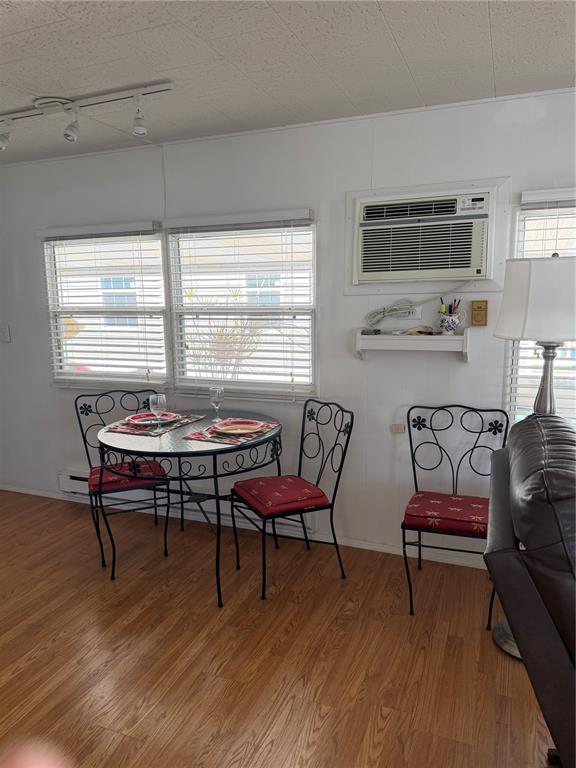 1040 Main Street, Unit 91 Dunedin, FL 34698 - Photo 8 of 25 a view of a livingroom with furniture window and wooden floor