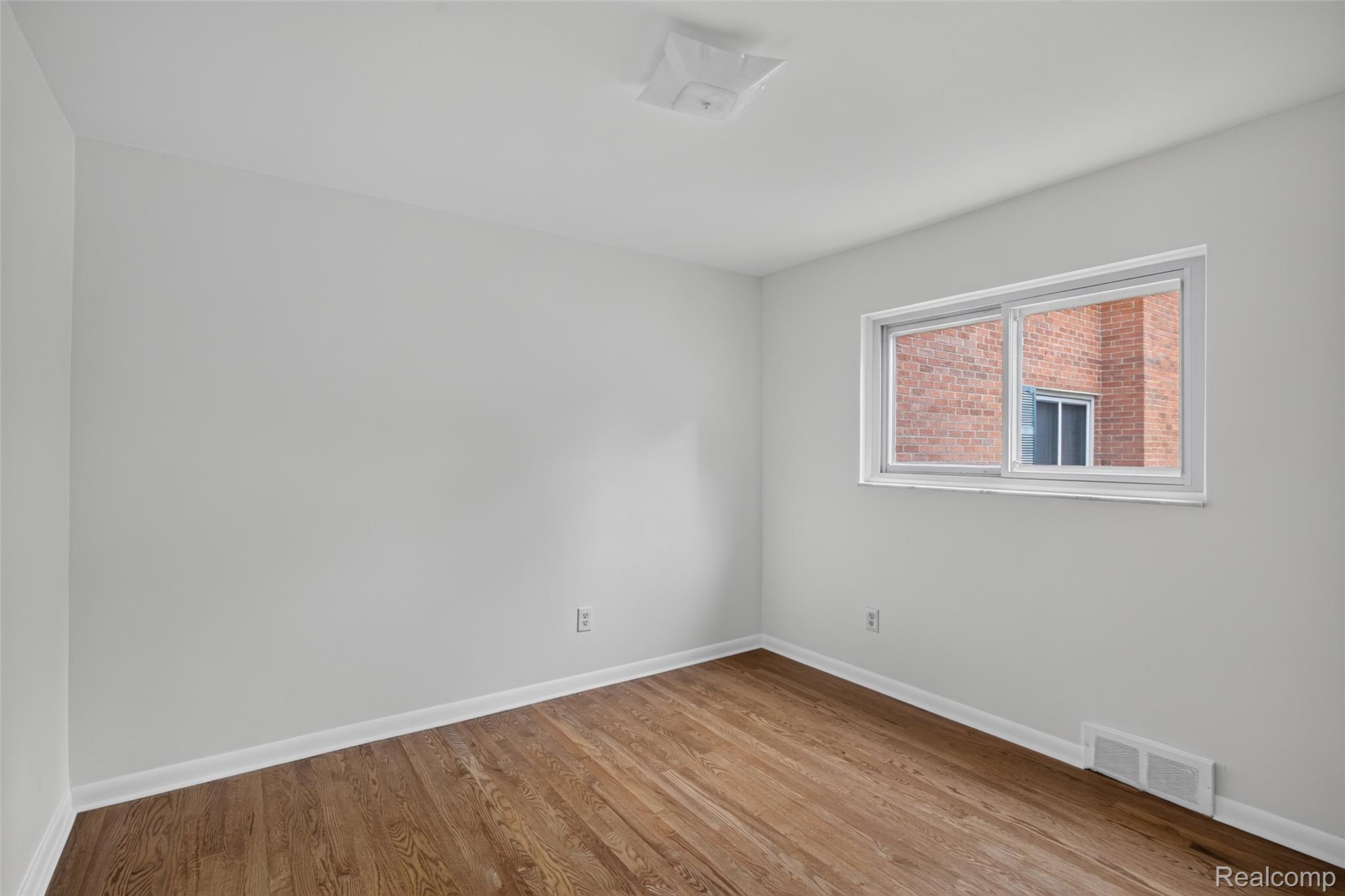 1225 Derby Road, Unit 3 Birmingham, MI 48009 - Photo 9 of 19 hardwood flooring , sunny room