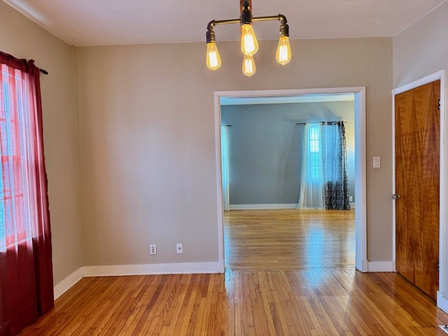 2918 Pershing Boulevard Clinton, IA 52732 - Photo 8 of 33 a view of empty room with wooden floor