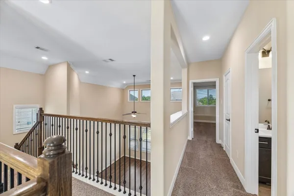 a view of a livingroom with a ceiling fan and window