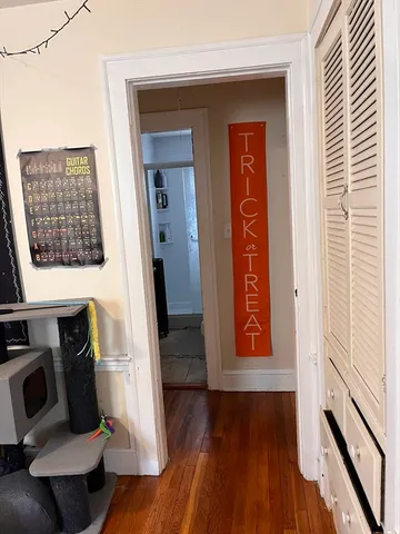 a view of an entryway with wooden floor