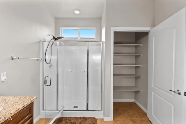 a bathroom with a shower tub and sink