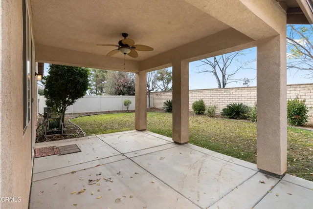 a view of a porch with potted plants