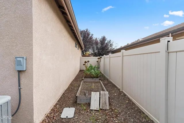a view of a pathway of a house with wooden floor