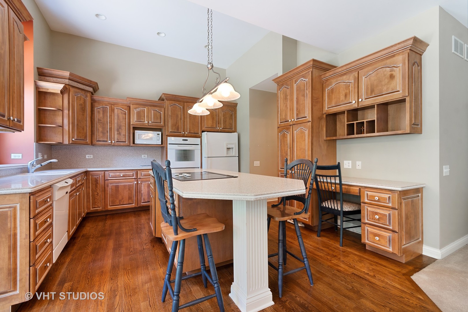 3603 Chesapeake Road St. Charles, IL 60175 - Photo 12 of 32 a kitchen with stainless steel appliances granite countertop a stove a sink dishwasher a dining table and chairs with wooden floor