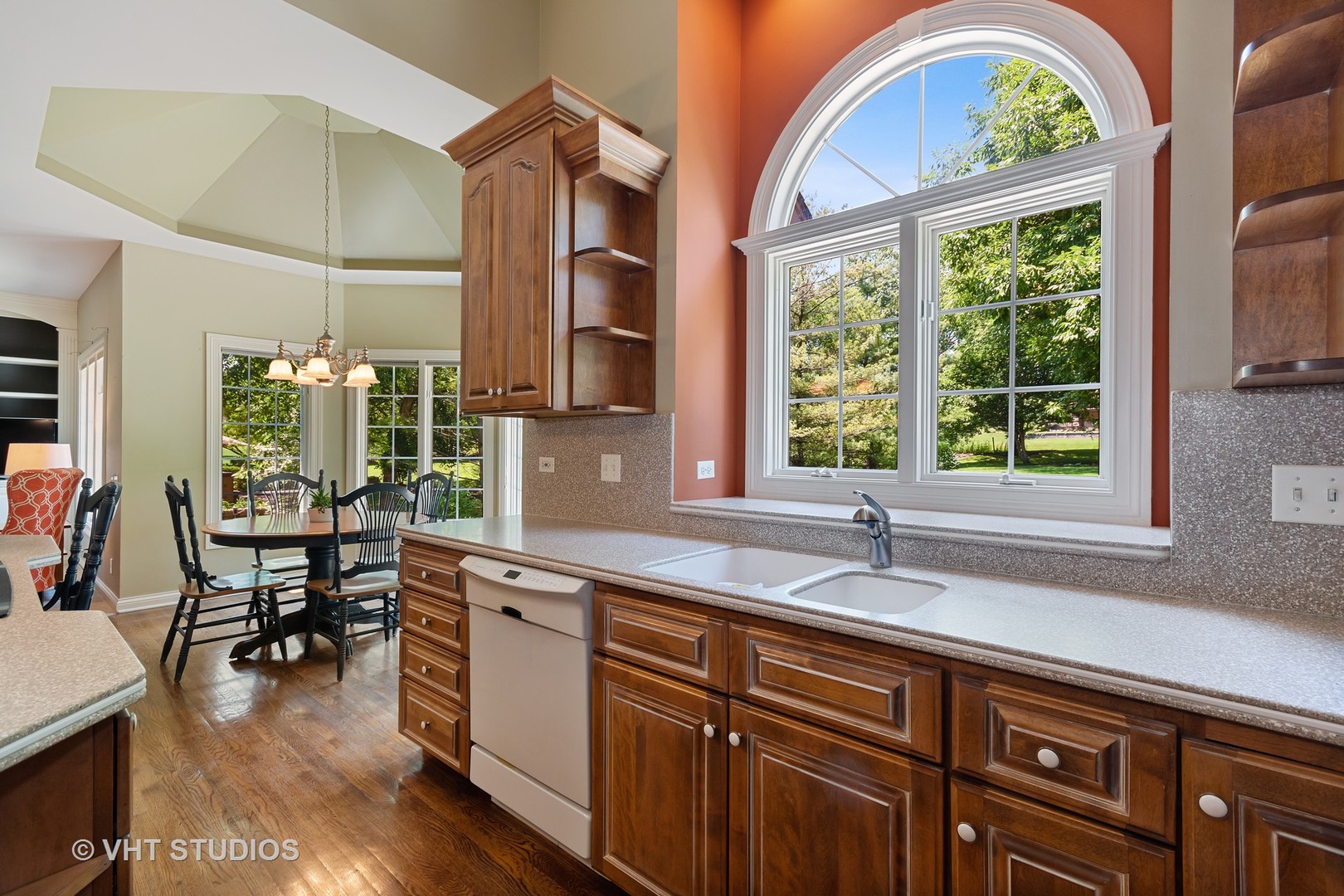 3603 Chesapeake Road St. Charles, IL 60175 - Photo 14 of 32 a kitchen with a window a sink and chairs