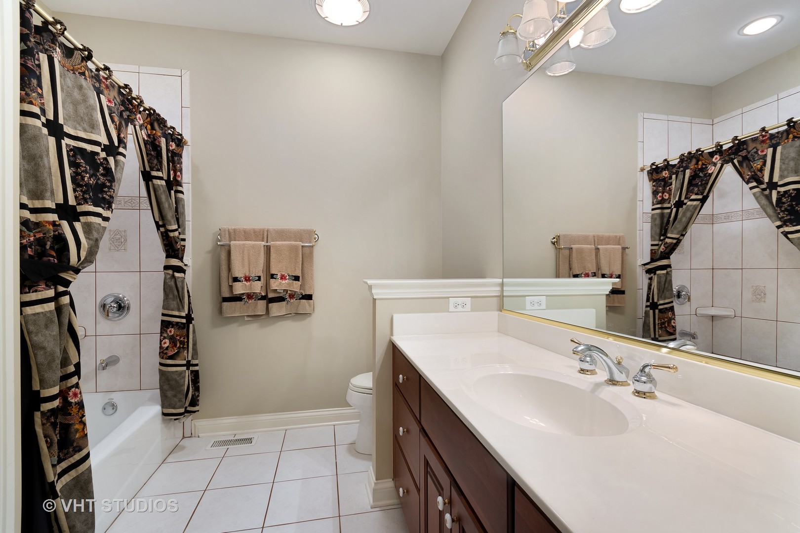 3603 Chesapeake Road St. Charles, IL 60175 - Photo 21 of 32 a bathroom with a sink mirror and shower