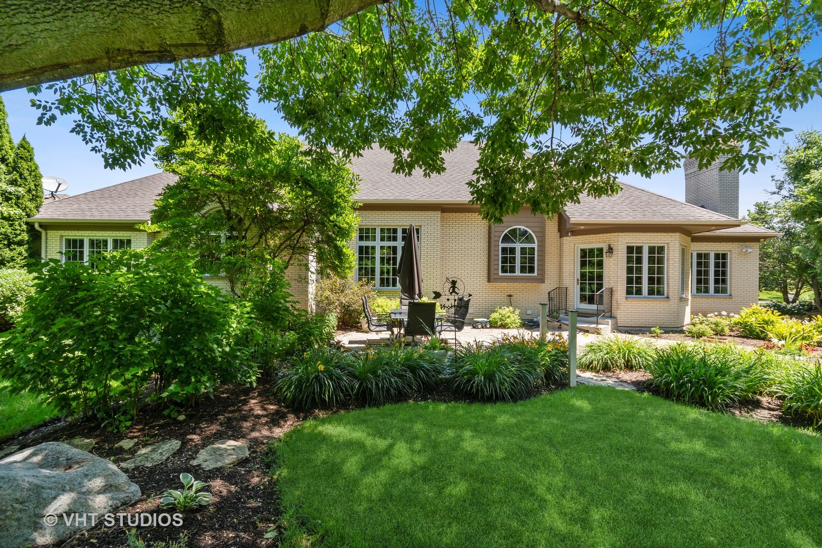 3603 Chesapeake Road St. Charles, IL 60175 - Photo 29 of 32 a view of a house with a yard and potted plants