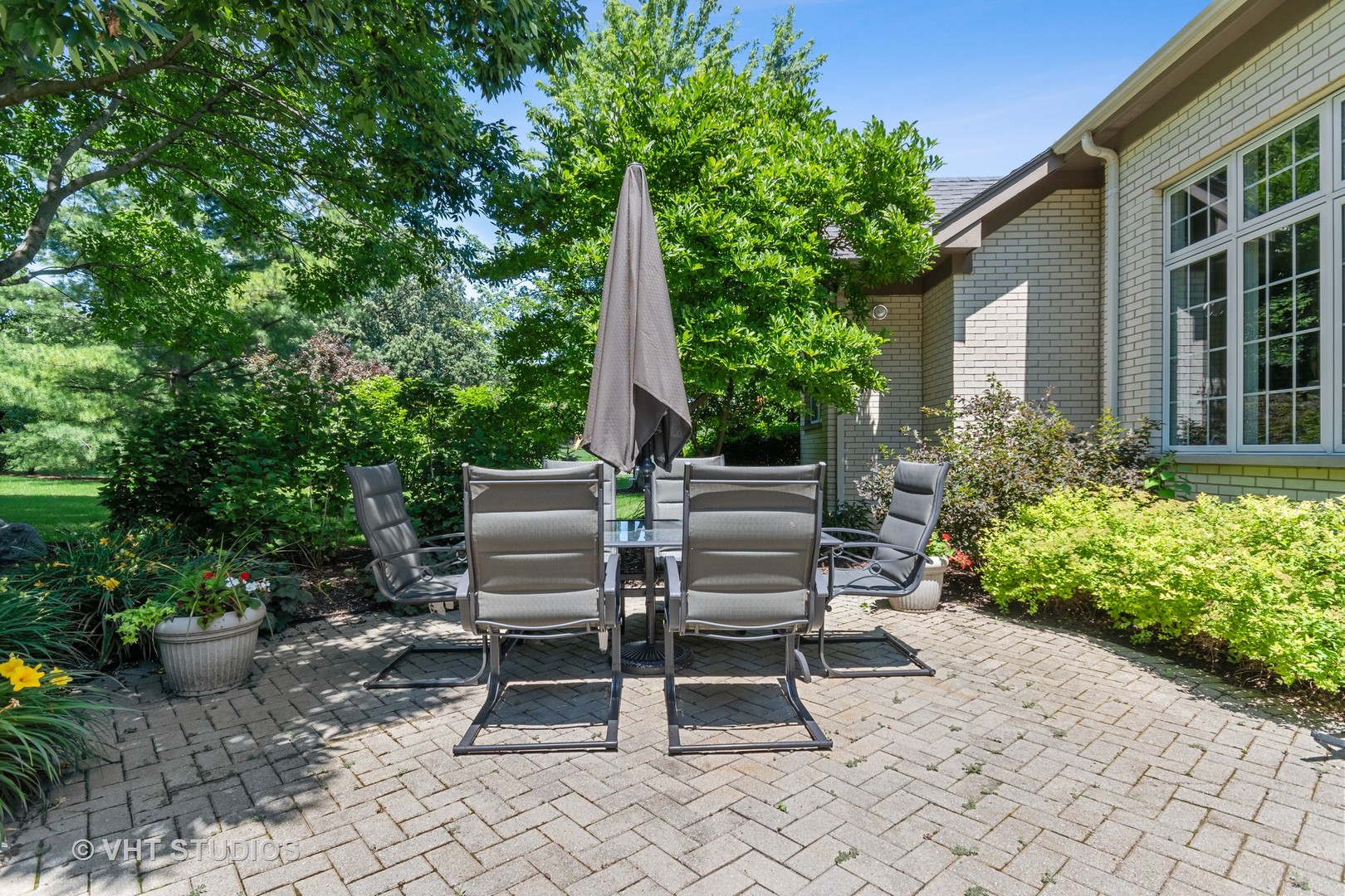 3603 Chesapeake Road St. Charles, IL 60175 - Photo 30 of 32 a view of a chair and tables in the backyard
