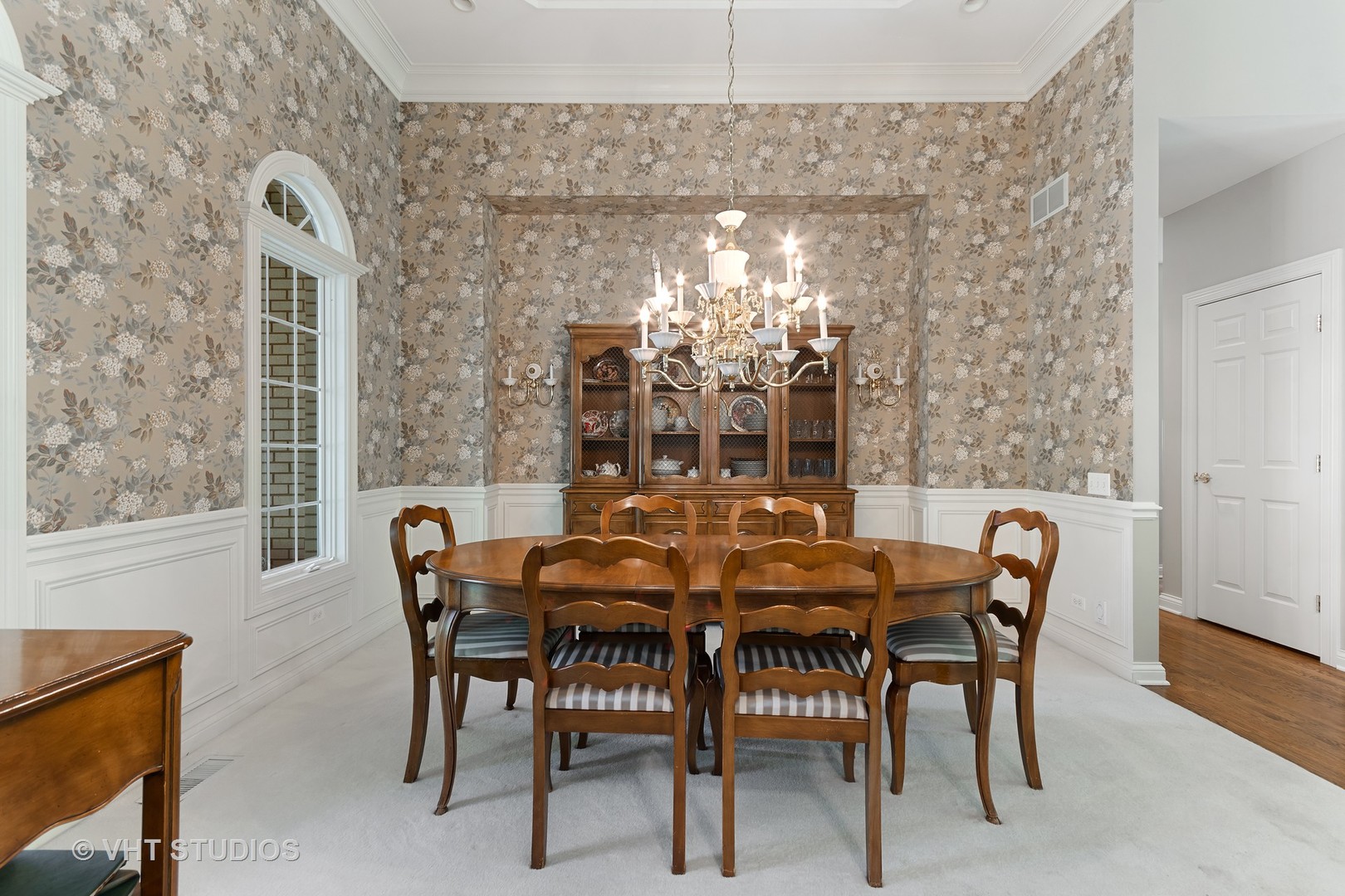 3603 Chesapeake Road St. Charles, IL 60175 - Photo 5 of 32 a view of a dining room with furniture and chandelier