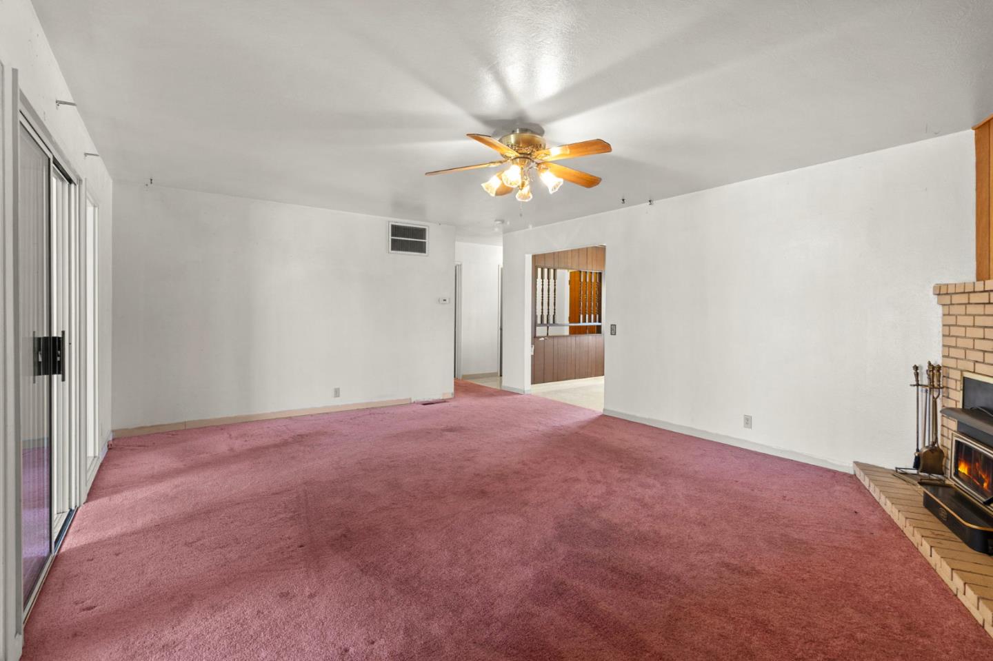 1949 Lincoln Street Seaside, CA 93955 - Photo 12 of 40 a view of a big room with windows and chandelier fan