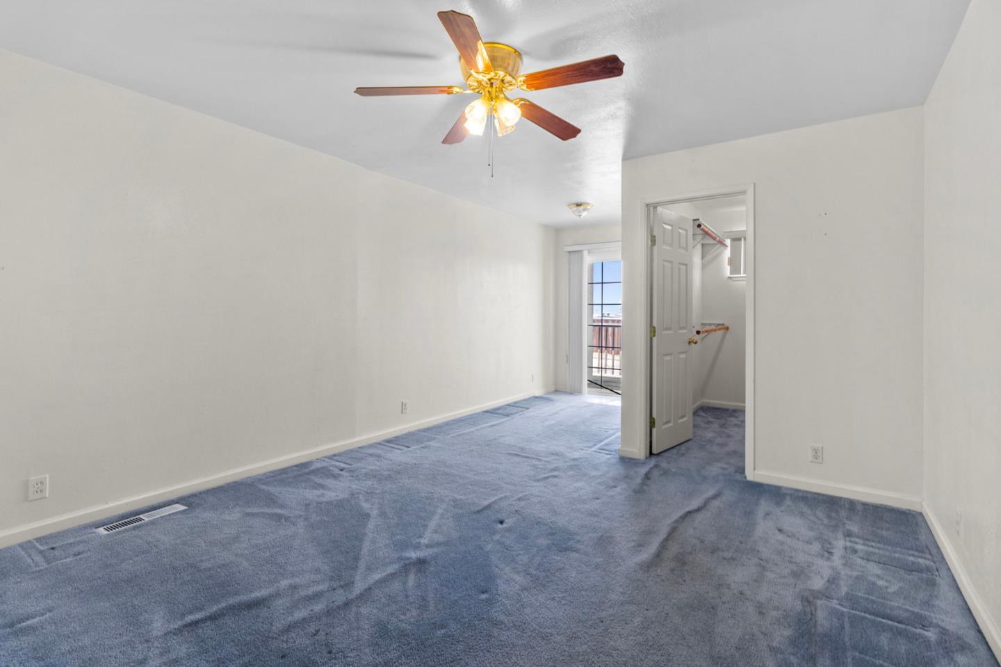 1949 Lincoln Street Seaside, CA 93955 - Photo 19 of 40 an empty room with closet and a chandelier fan